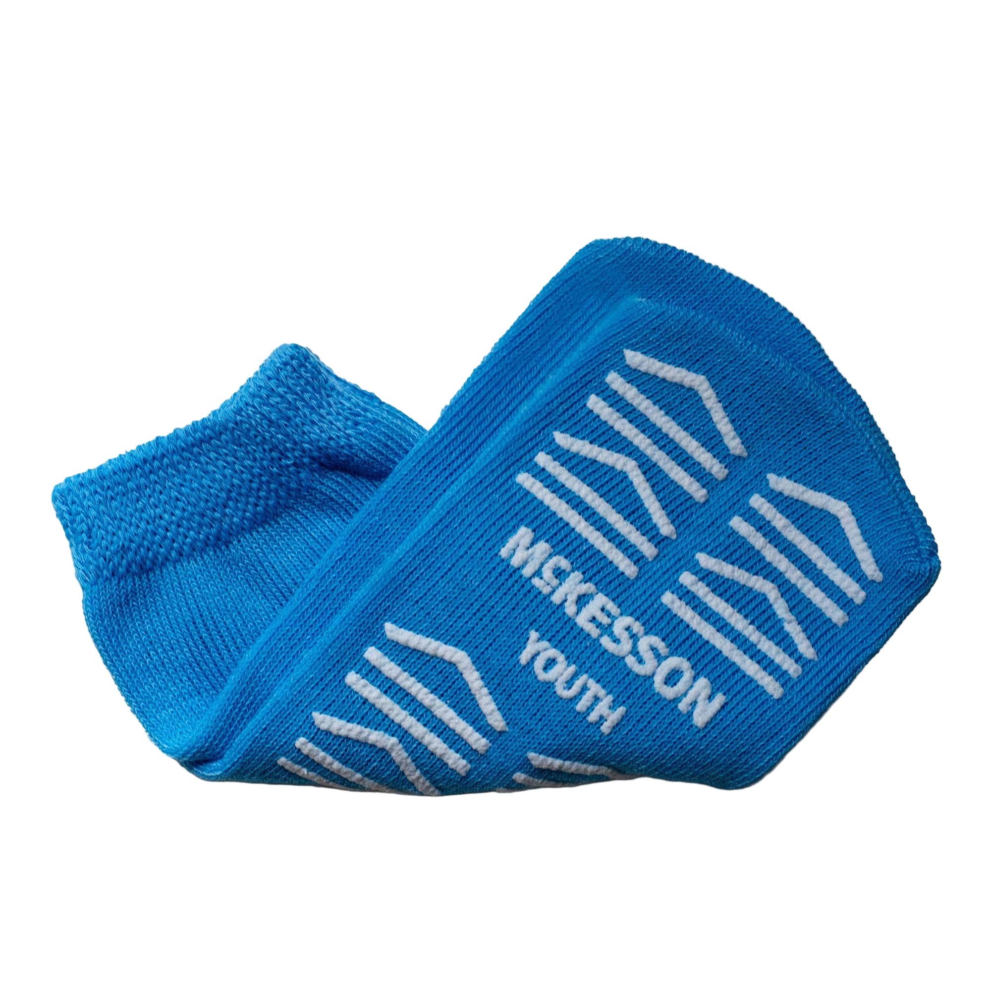 Light blue McKesson unisex youth slipper socks with single tread for patient safety and comfort