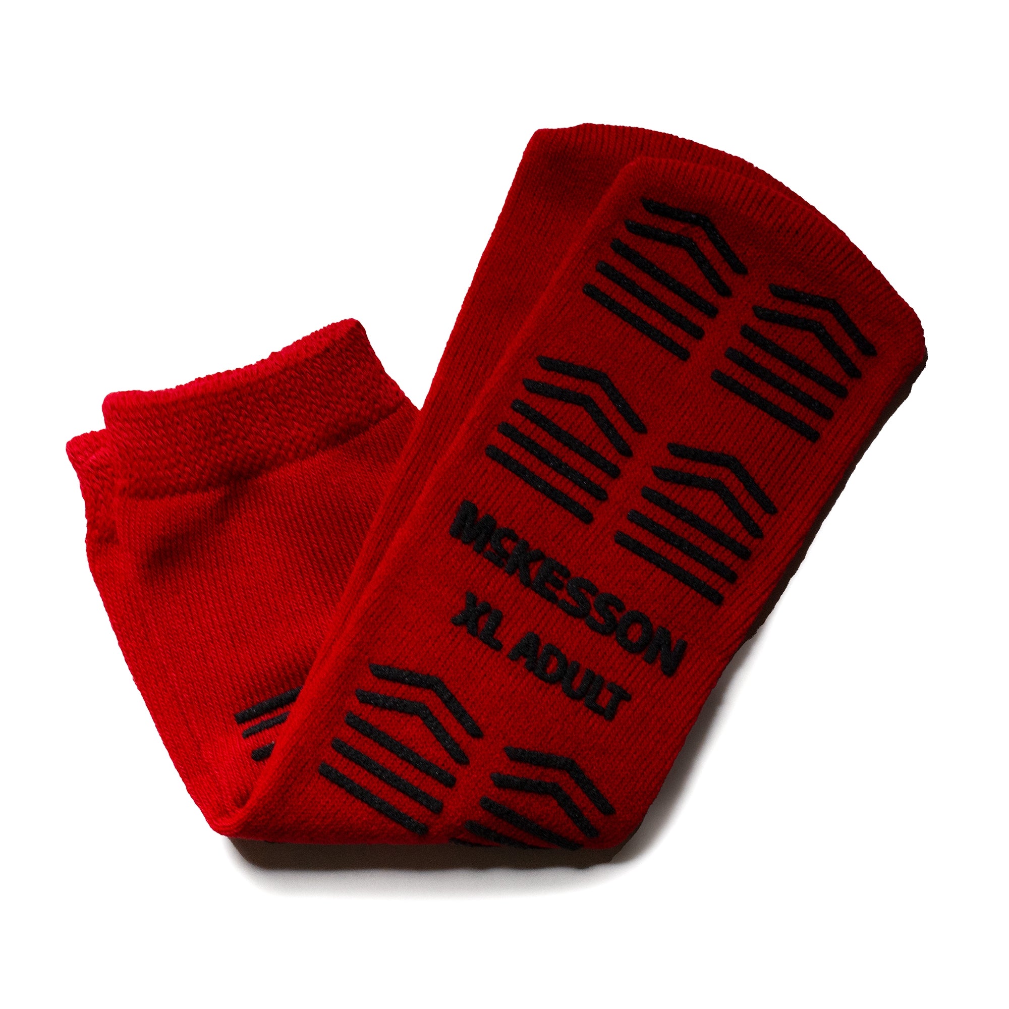 McKesson Adult Large Slipper Socks in red with full-sole safety tread for slip resistance. Soft, breathable polyester knit with elastic cuff for secure, comfortable fit—ideal for home or healthcare use.